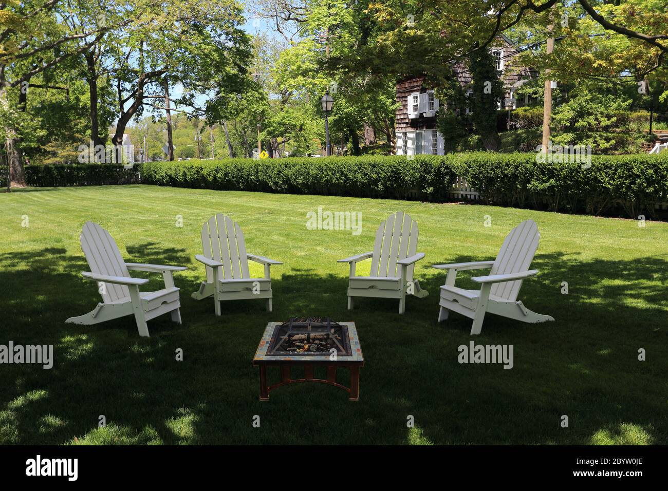 Adirondack chairs on lawn Stony Brook Long Island New York Stock Photo