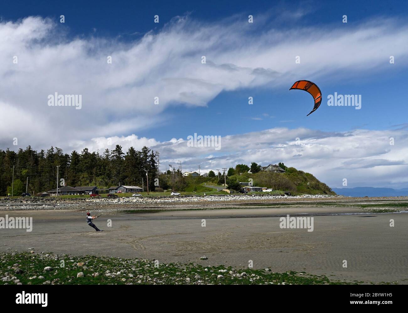 Practicing wind surfing on a sandy beach Point Holmes, Comox Valley, Vancouver Island, B.C Canada Stock Photo