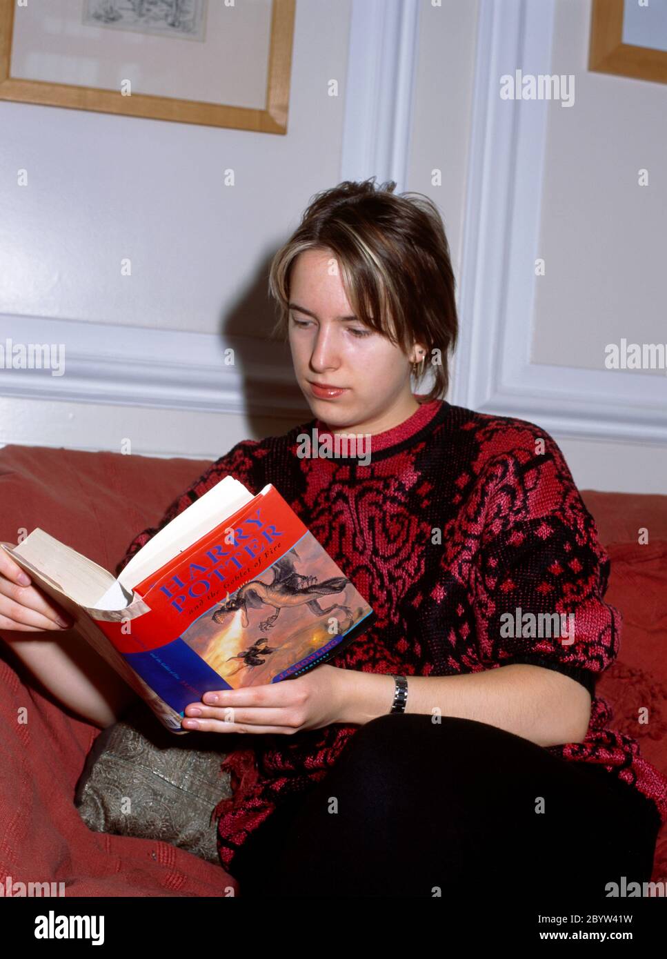 Nineteen Year old Reading Harry Potter  and the Goblet of Fire Stock Photo