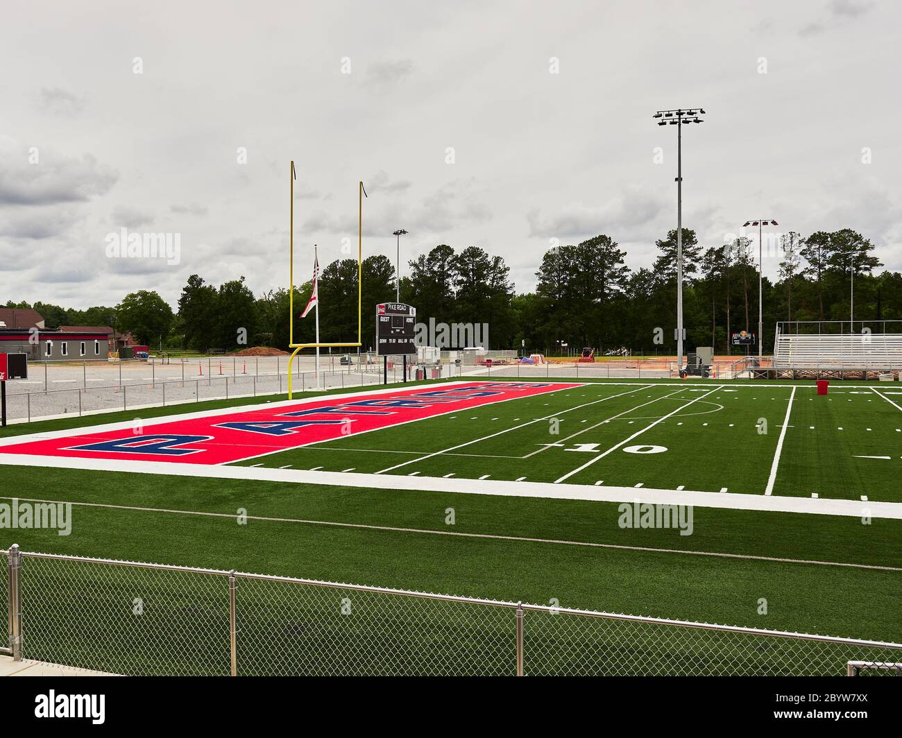 New colorful artificial turf at the end zone and goal post of a high school football field in Pike Road Alabama, USA. Stock Photo