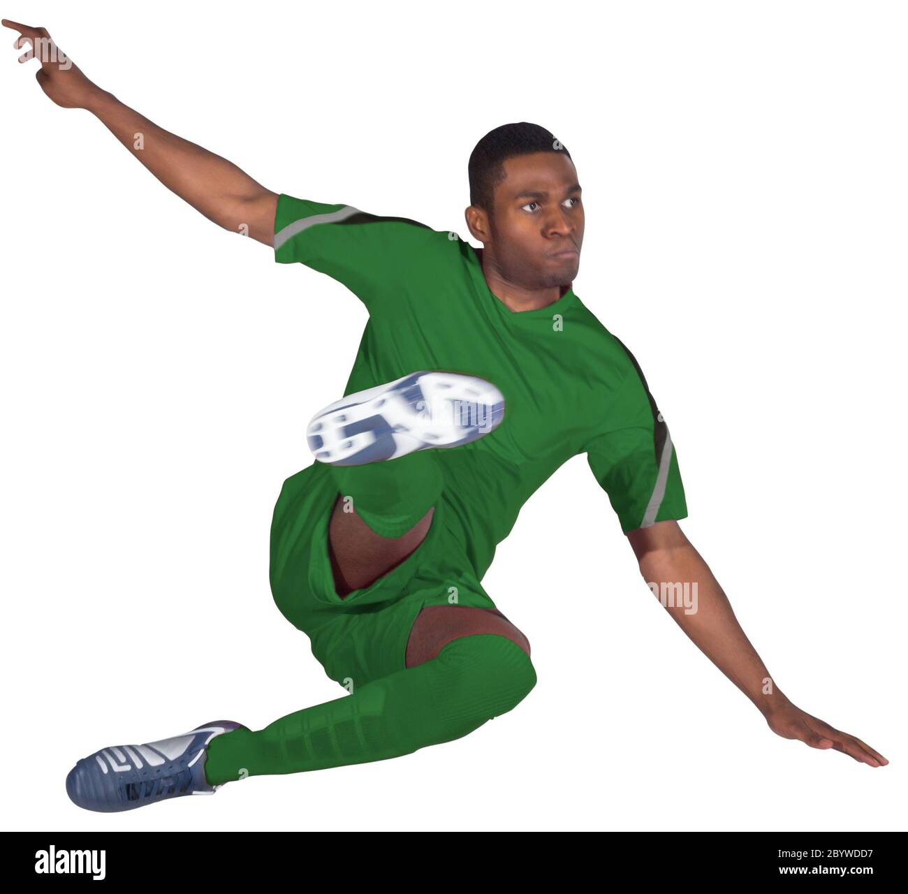 Football player in green kicking Stock Photo - Alamy