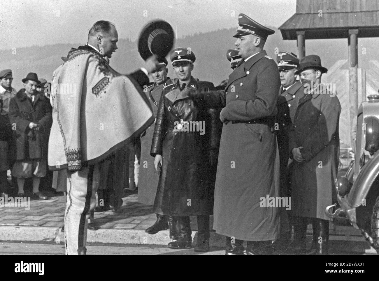 Chairman of the Highlanders Committee Wacław Krzeptowski (left) greets Governor Hans Frank after arriving in Zakopane ca. 1939 Stock Photo