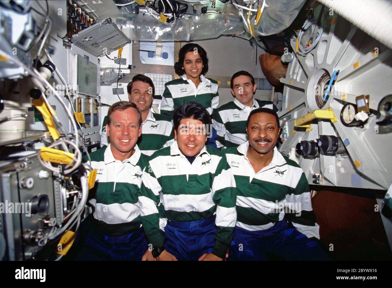 (19 November - 5 December 1997) --- On the Space Shuttle Columbia's middeck, the crewmembers for the mission pose for the traditional in-flight portrait. In front, left to right, are astronauts Steven W. Lindsey, pilot; Takao Doi, mission specialist representing Japan's National Space Development Agency (NASDA); and Winston E. Scott, mission specialist. In back are, from the left, astronauts Kevin R. Kregel, commander; and Kalpana Chawla, mission specialist; along with payload specialist Leonid Kadenyuk. Stock Photo