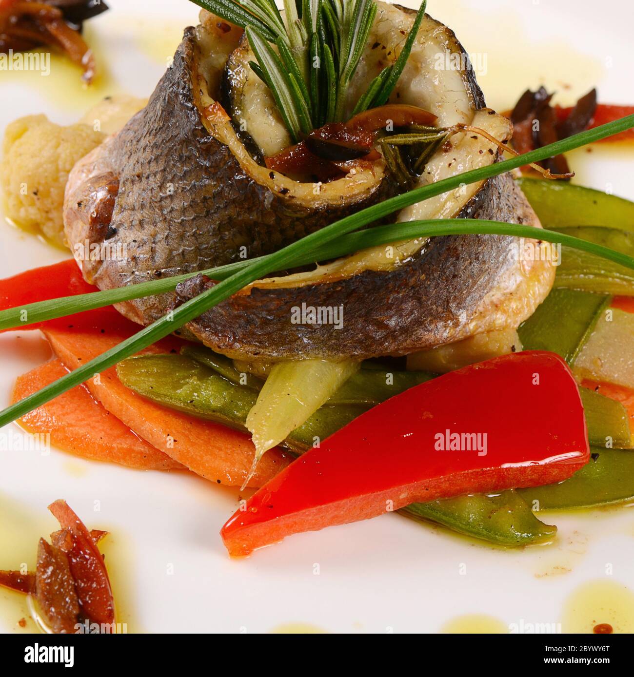 Sea bass fillet with spring vegetables Stock Photo Alamy