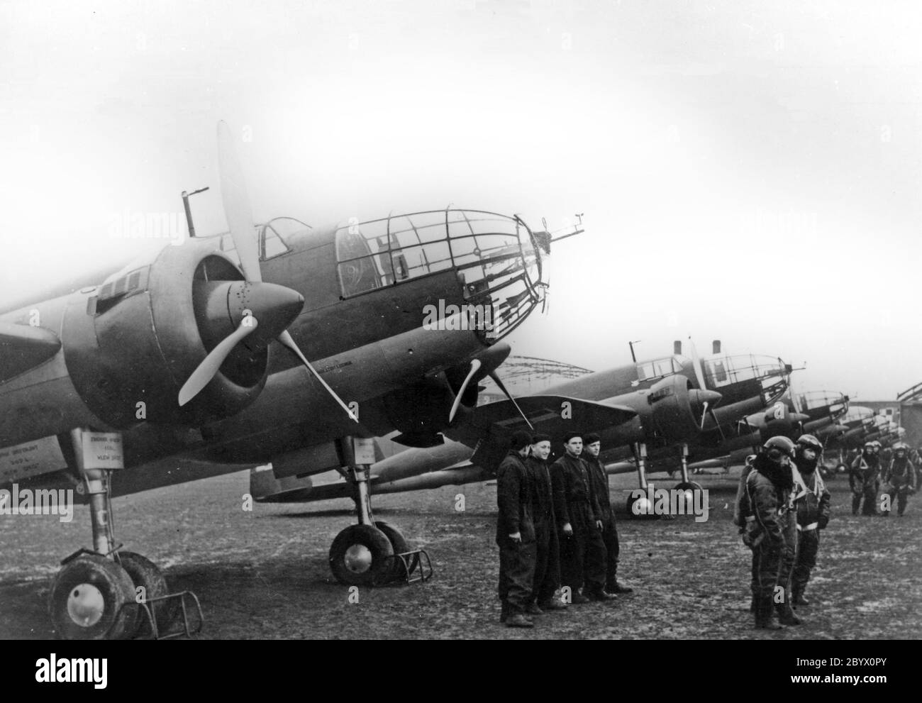 PZL.37 Łoś (moose), a Polish twin-engined medium bomber designed and manufactured by national aircraft company PZL (Moose Crews next to their planes) Stock Photo