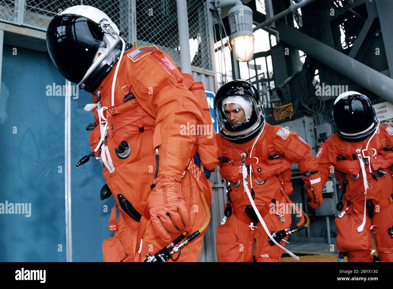 Three members of the STS-83 flight crew head toward the orbiter access arm on the 195-foot level Launch of Pad 39A that will take them to the crew hatch of the Space Shuttle Columbia during Terminal Countdown Demonstration Test (TCDT) exercises for that mission. Mission Specialist Donald A. Thomas is in the center of the group. Other crew members on the 16-day Microgravity Science Laboratory-1 (MSL-1) mission are: Mission Commander James D. Halsell, Jr.; Pilot Susan L. Still; Payload Commander Janice Voss; Mission Specialist Michael L.Gernhardt; and Payload Specialists Gregory T. Linteris and Stock Photo