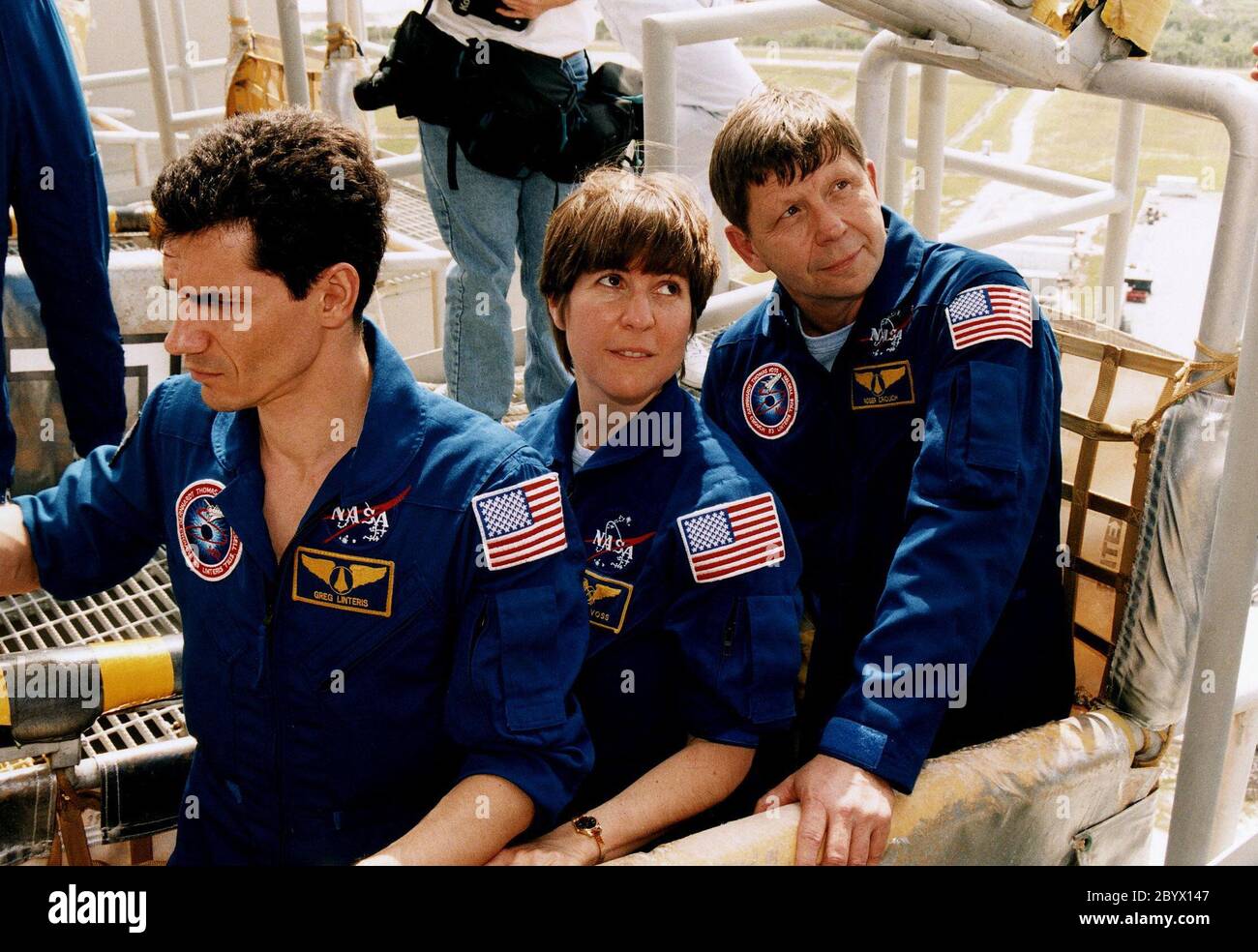 STS-83 Payload Specialist Gregory T. Linteris, Mission Specialist Janice E. Voss, and Payload Specialist Roger K. Crouch participate in emergency egress training at Launch Complex 39A during the crew's Terminal Countdown Demonstration Test (TCDT). They are seen here in one of the pads' seven slidewire baskets. Stock Photo