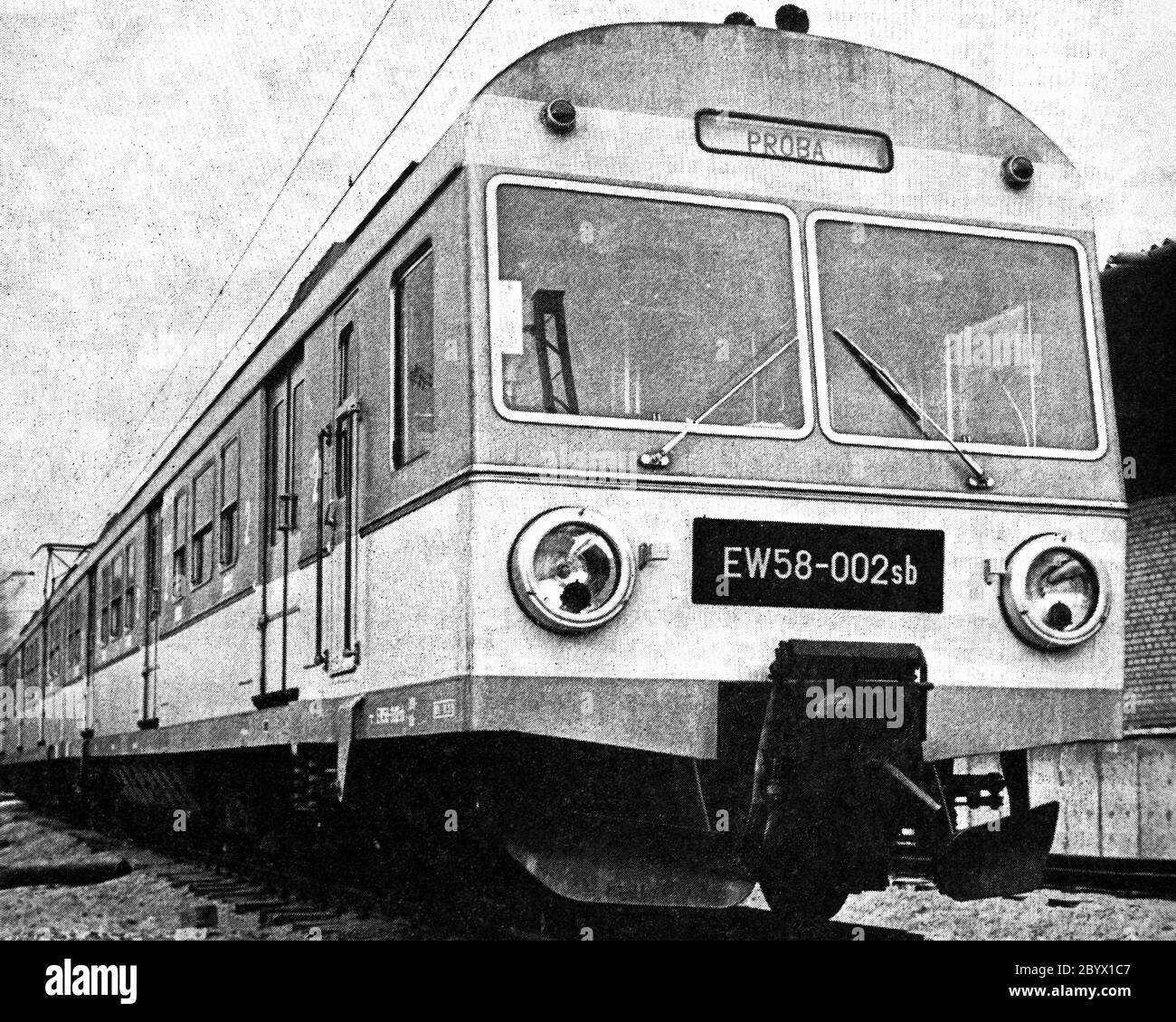 The EW58-002 electric multiple unit intended for the Fast Urban Railway in the Tri-City stands before or after the test drive on the entry track to the then Central Railway Research and Development Center in Grochów in Warsaw ca. 1975 Stock Photo