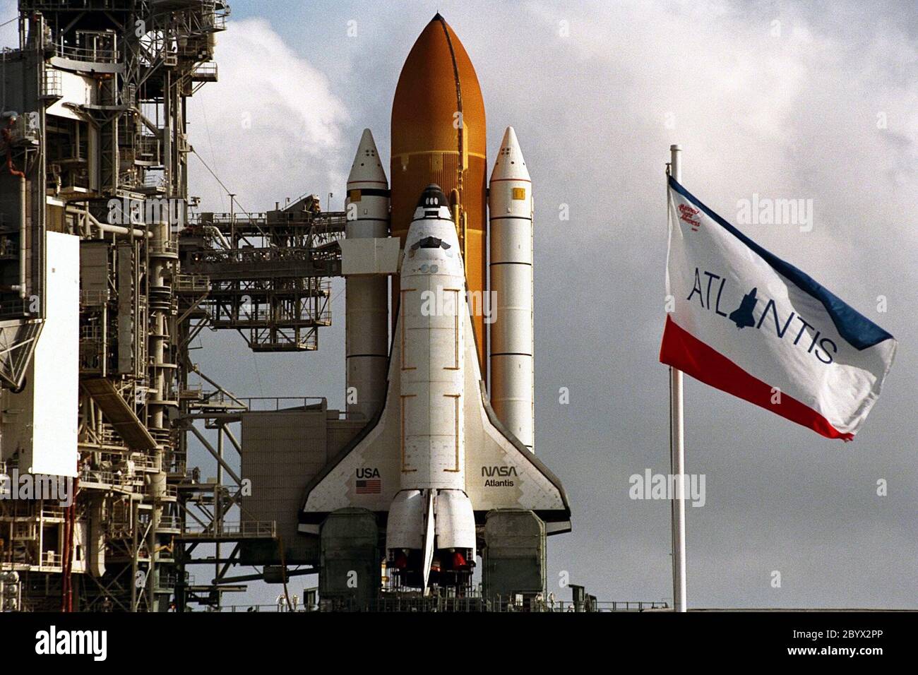 KENNEDY SPACE CENTER,  Fla. -- With its rotating service structure (RSS) rotated back, the Space Shuttle Atlantis appears ready for flight at Launch Pad 39A. But there are still about three weeks of preparations until the planned launch of Mission STS-86 on Sept. 25. The RSS is rolled back to allow for the insertion of the major payload, the SPACEHAB Double Module, into the orbiter’s cargo bay. SPACEHAB will be used to transport items to and from the Russian Space Shuttle Mir on Mission STS-86, which will be the seventh docking of the Shuttle with the Mir. About three-and-a-half tons of scienc Stock Photo