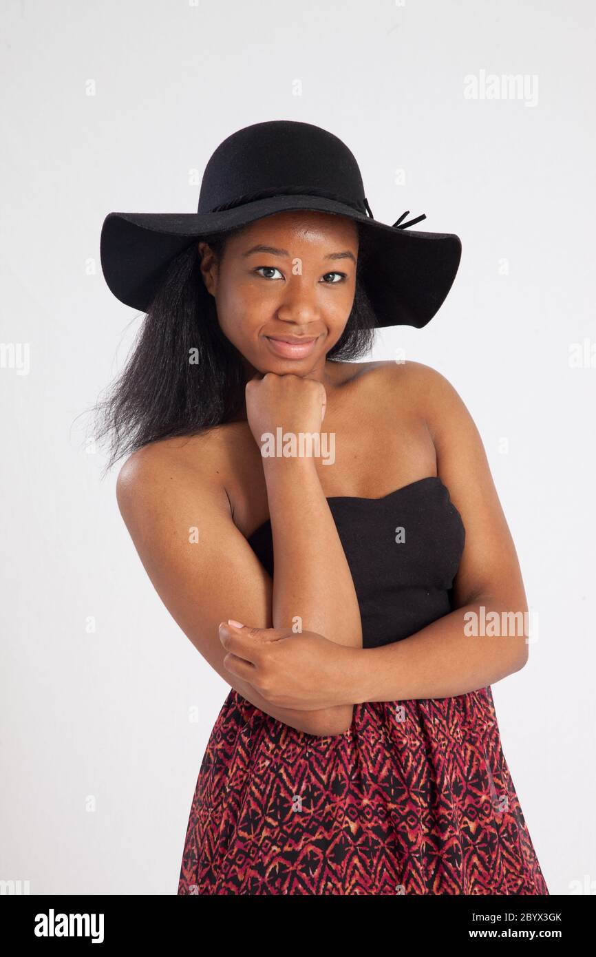 Happy black woman in a black hat Stock Photo - Alamy