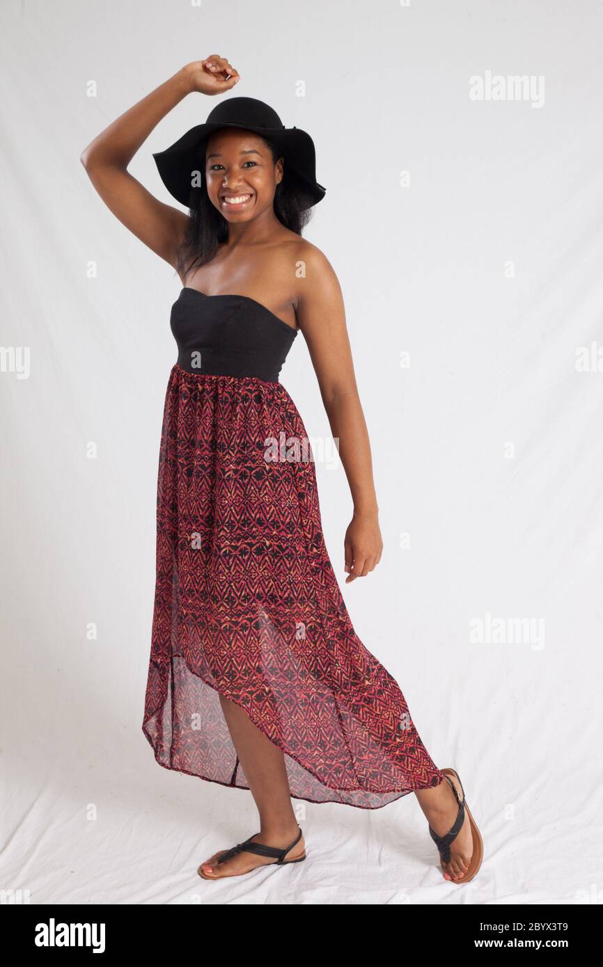 Happy black woman in a black hat Stock Photo - Alamy