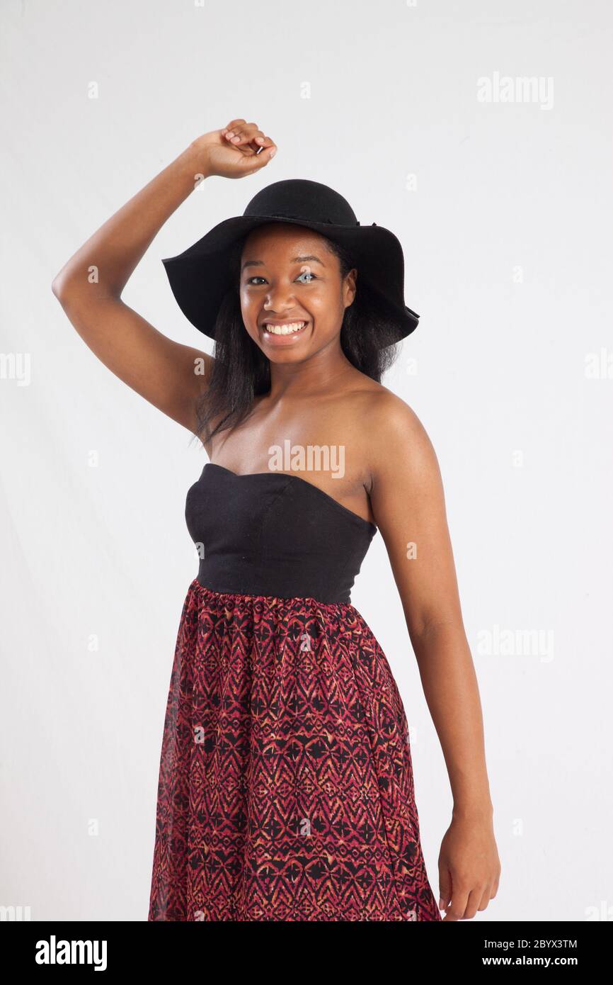 Happy black woman in a black hat Stock Photo - Alamy