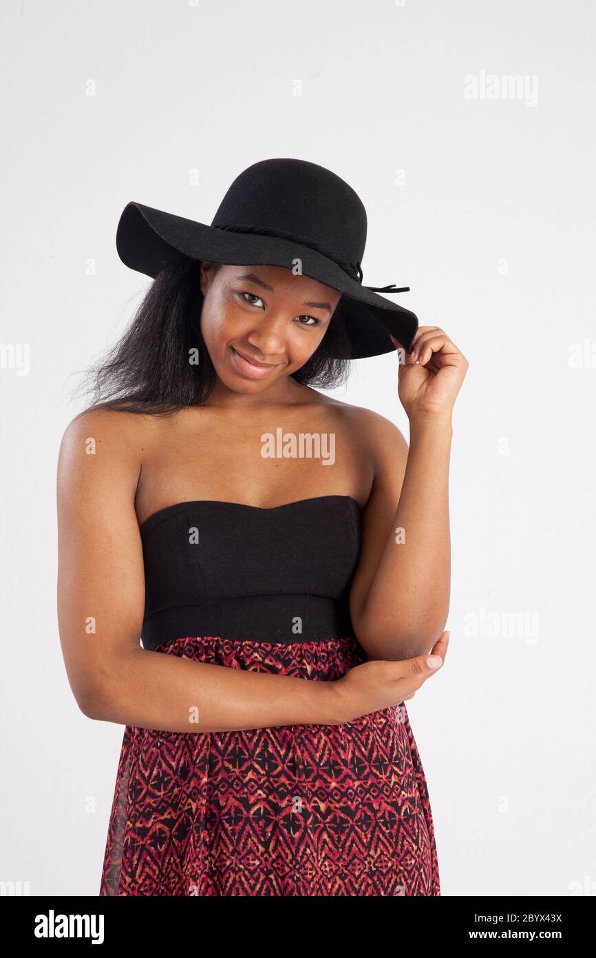 Happy black woman in a black hat Stock Photo - Alamy