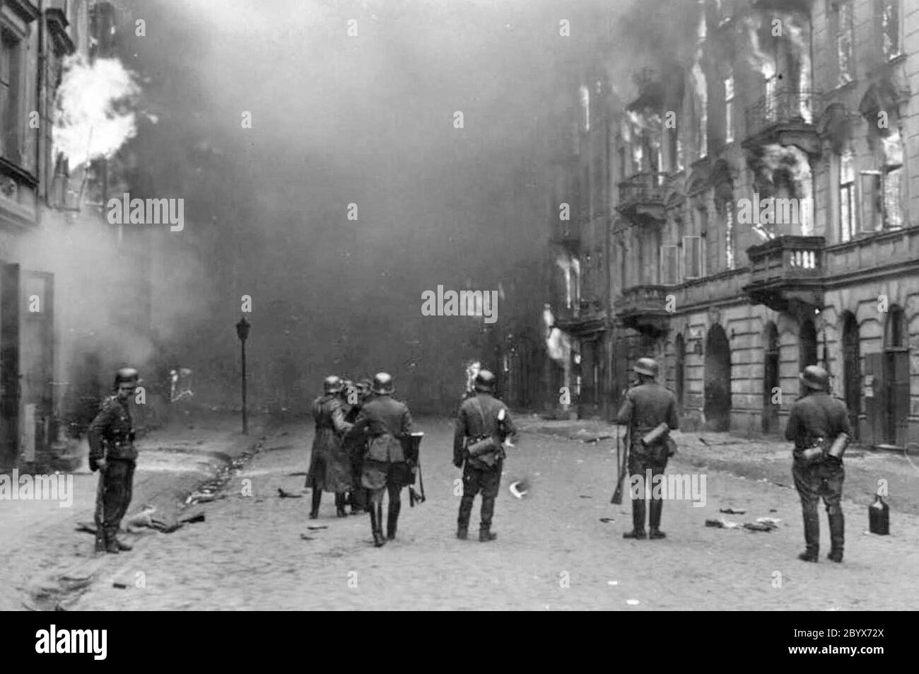 Stroop Report - Warsaw Ghetto Uprising - Nazi soldiers burning buidings in Warsaw Ghetto ca. 1943 Stock Photo
