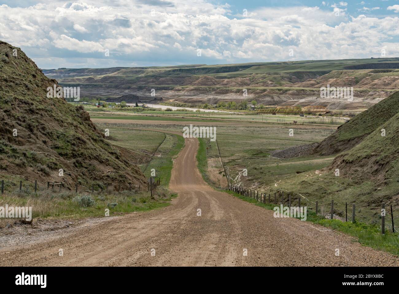 Descending Highway 848 south into Red Deer River Valley. Southeast of Drumheller, Alberta, Canada in springtime. Hamlet of Dorothy at left. Stock Photo
