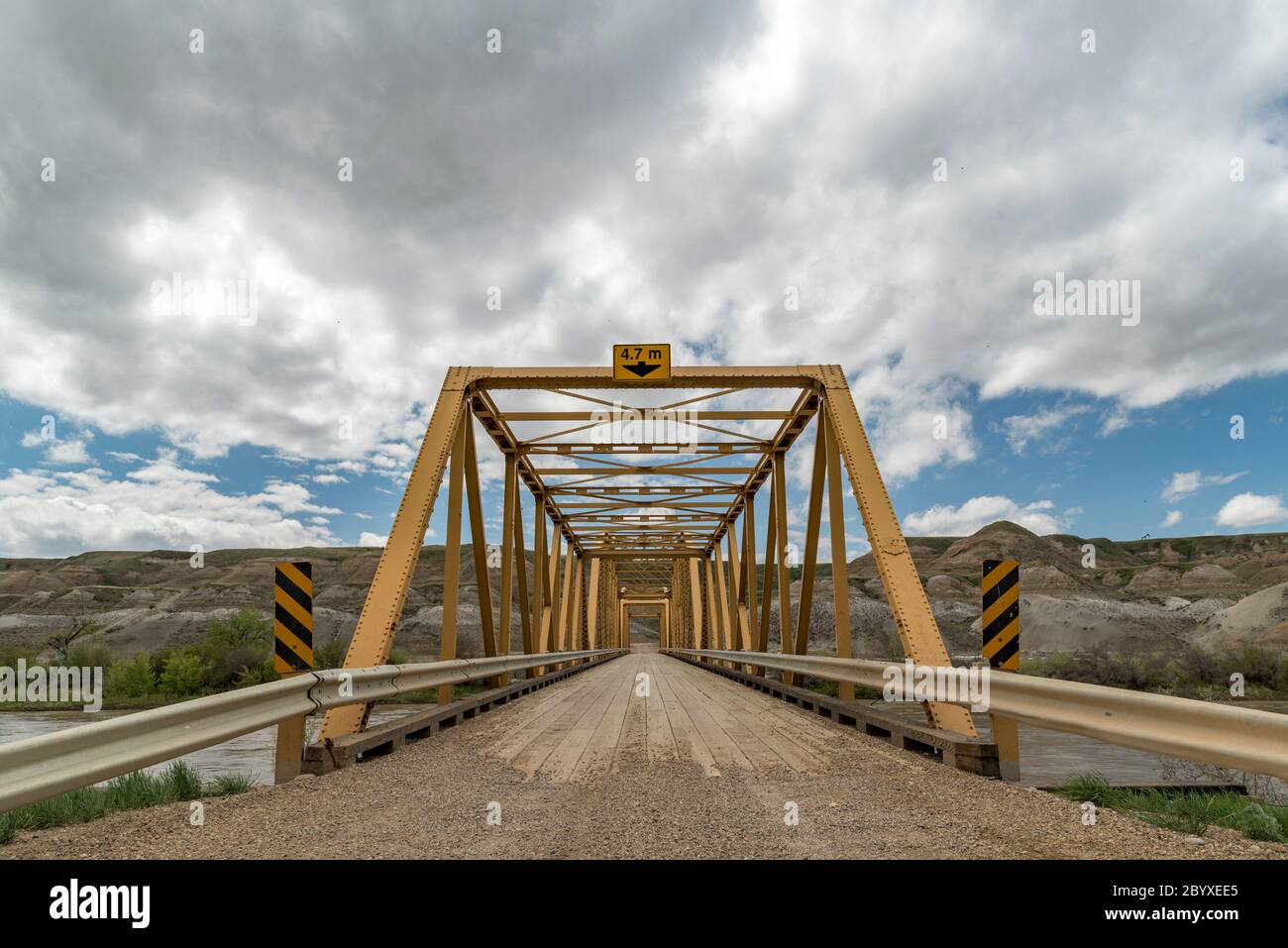 Wide angle view of Highway 848 bridge crossing the Red Deer River west of Dorothy. Southeast of Drumheller, Alberta, Canada in springtime. Stock Photo