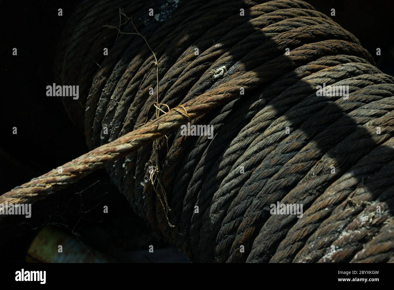 Old hawser on the drum of a windlass or winch Stock Photo Alamy
