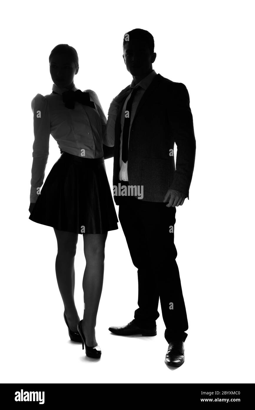 Stylish couple standing side by side Stock Photo