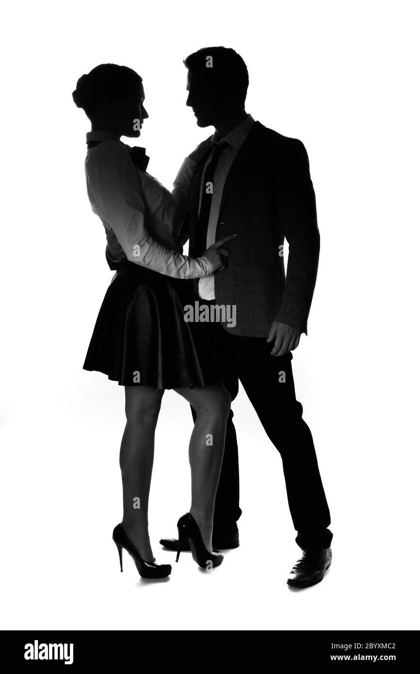 Silhouetted couple standing hi-res stock photography and images - Alamy