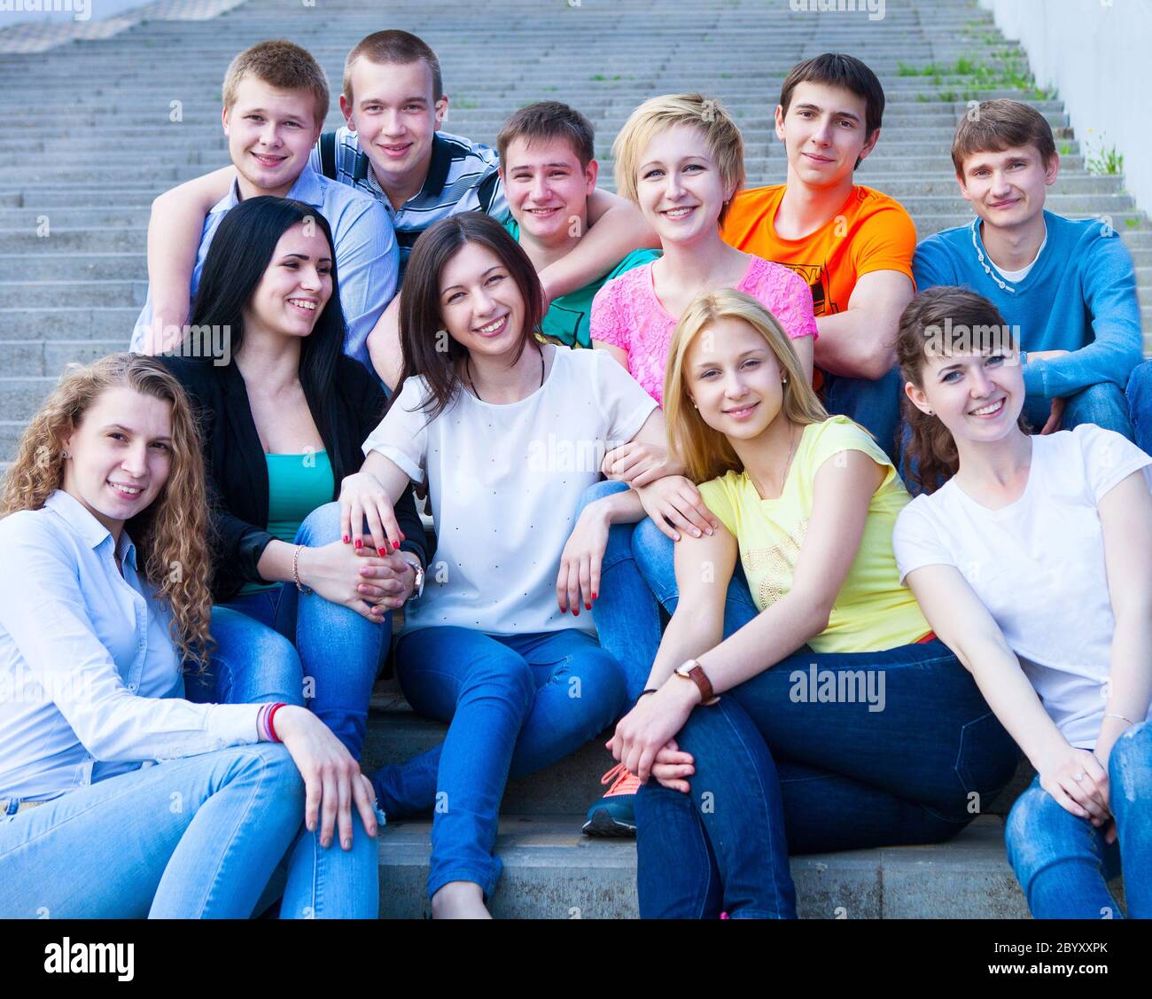 Group of smiling teenagers outdoors Stock Photo