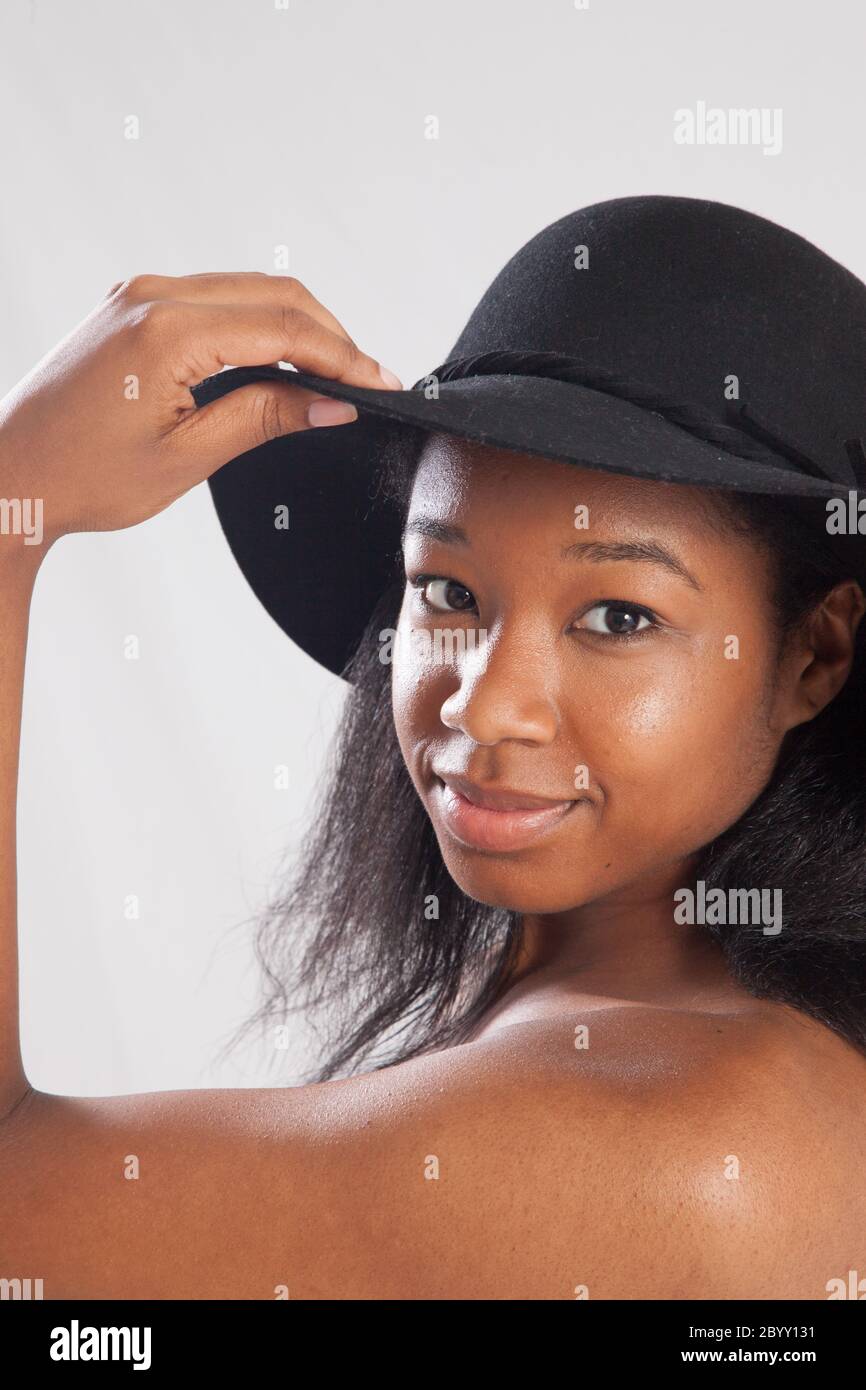 Happy black woman in a black hat Stock Photo - Alamy