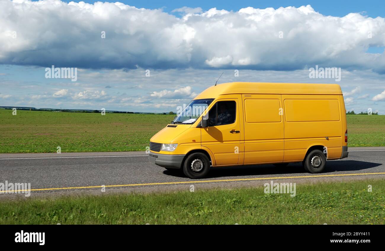 yellow delivery truck Stock Photo Alamy