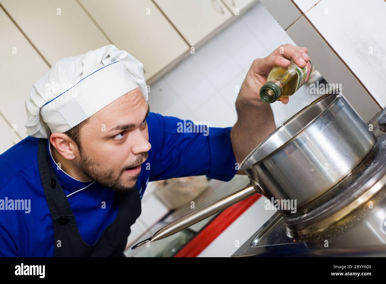 chef cooking a soup Stock Photo