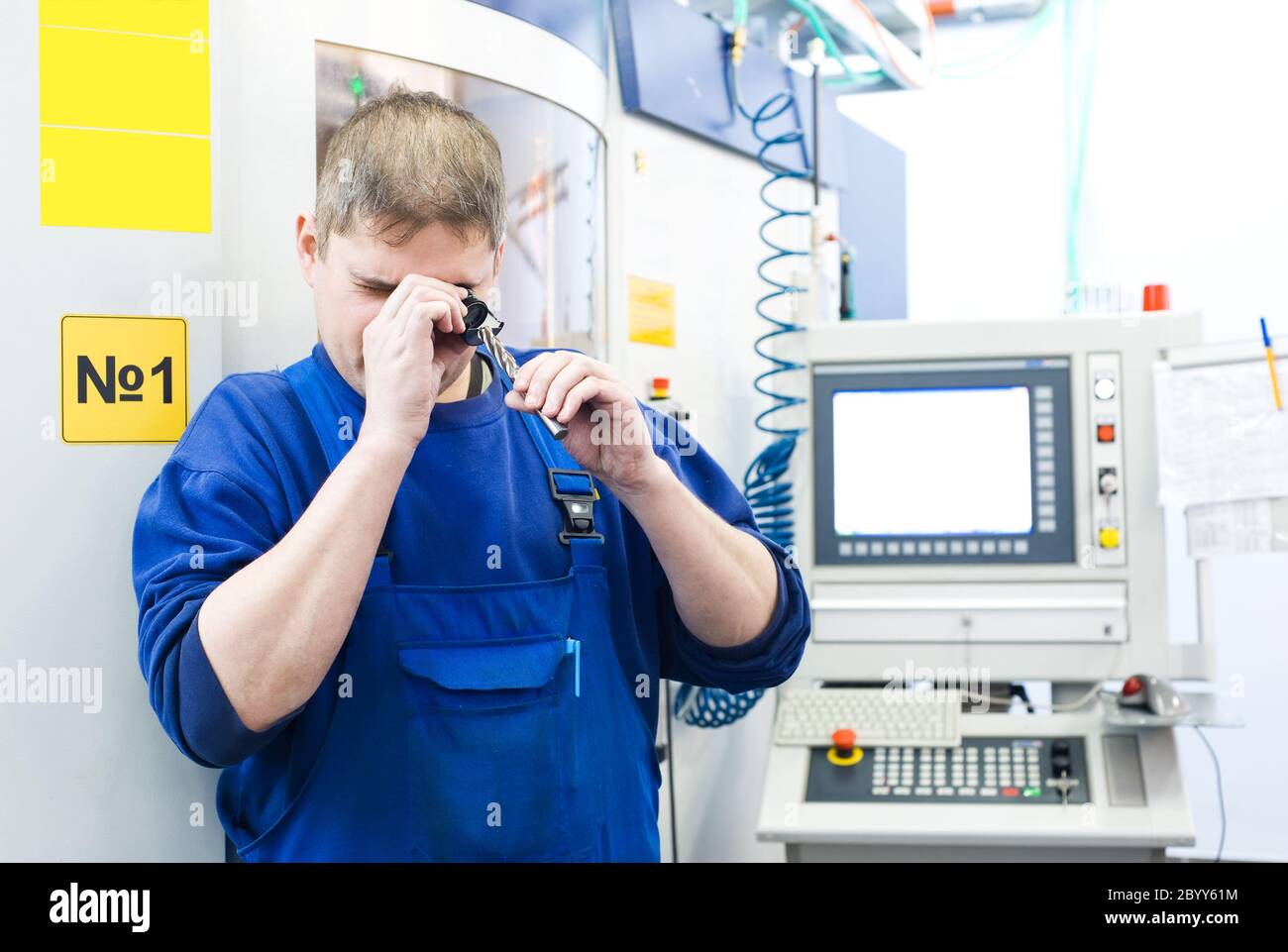 worker measuring detail Stock Photo