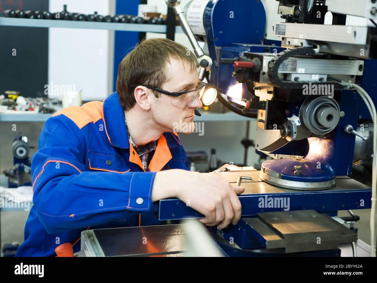 Machine Tools Worker worker at machine tool operating Stock Photo - Alamy