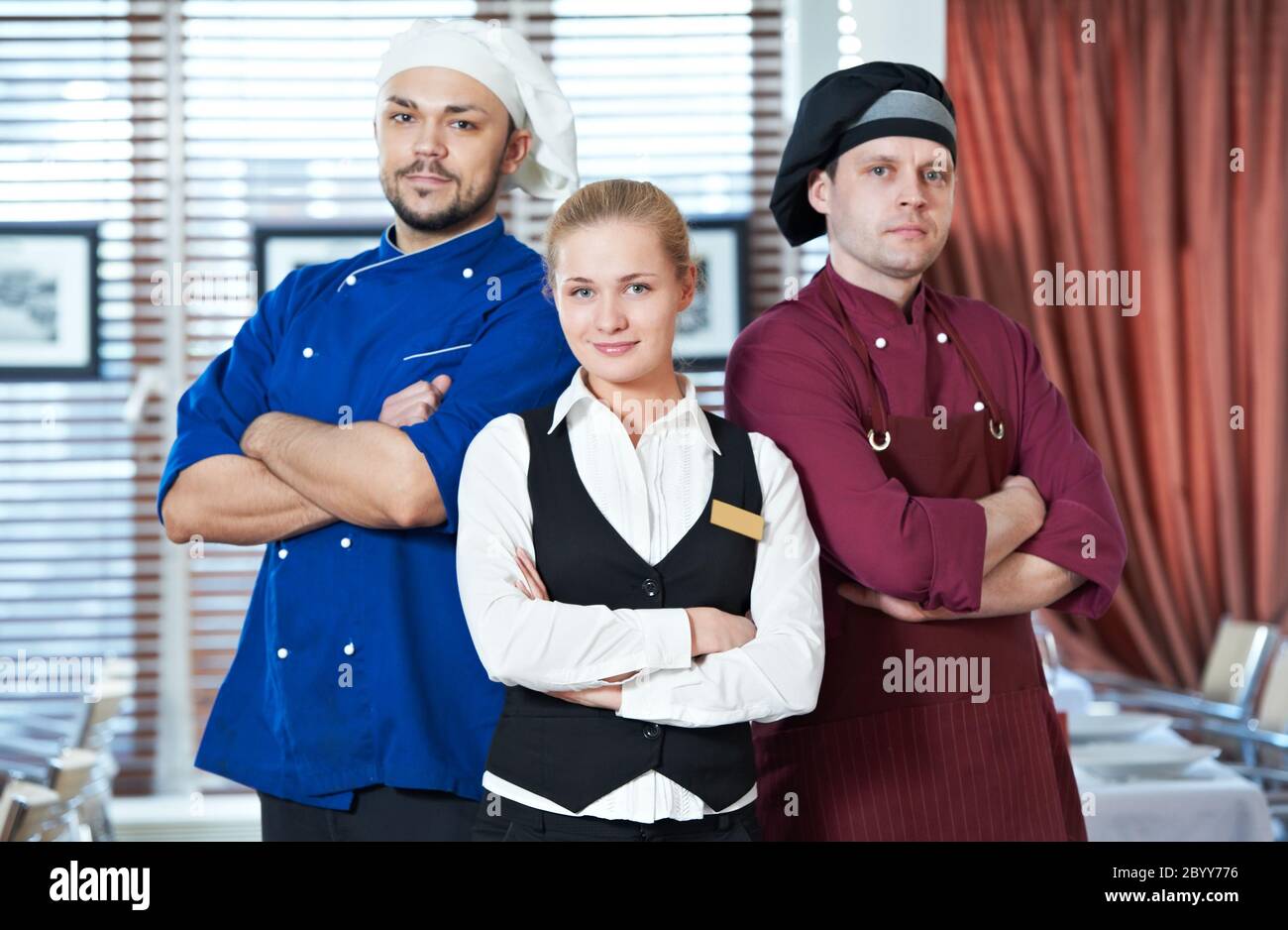 restaurant administrator and chefs Stock Photo