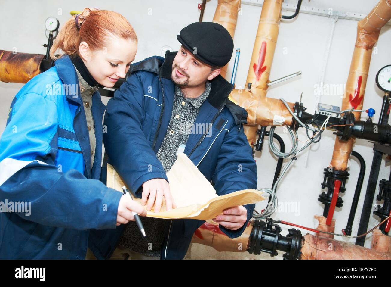 heating engineers in boiler room Stock Photo Alamy