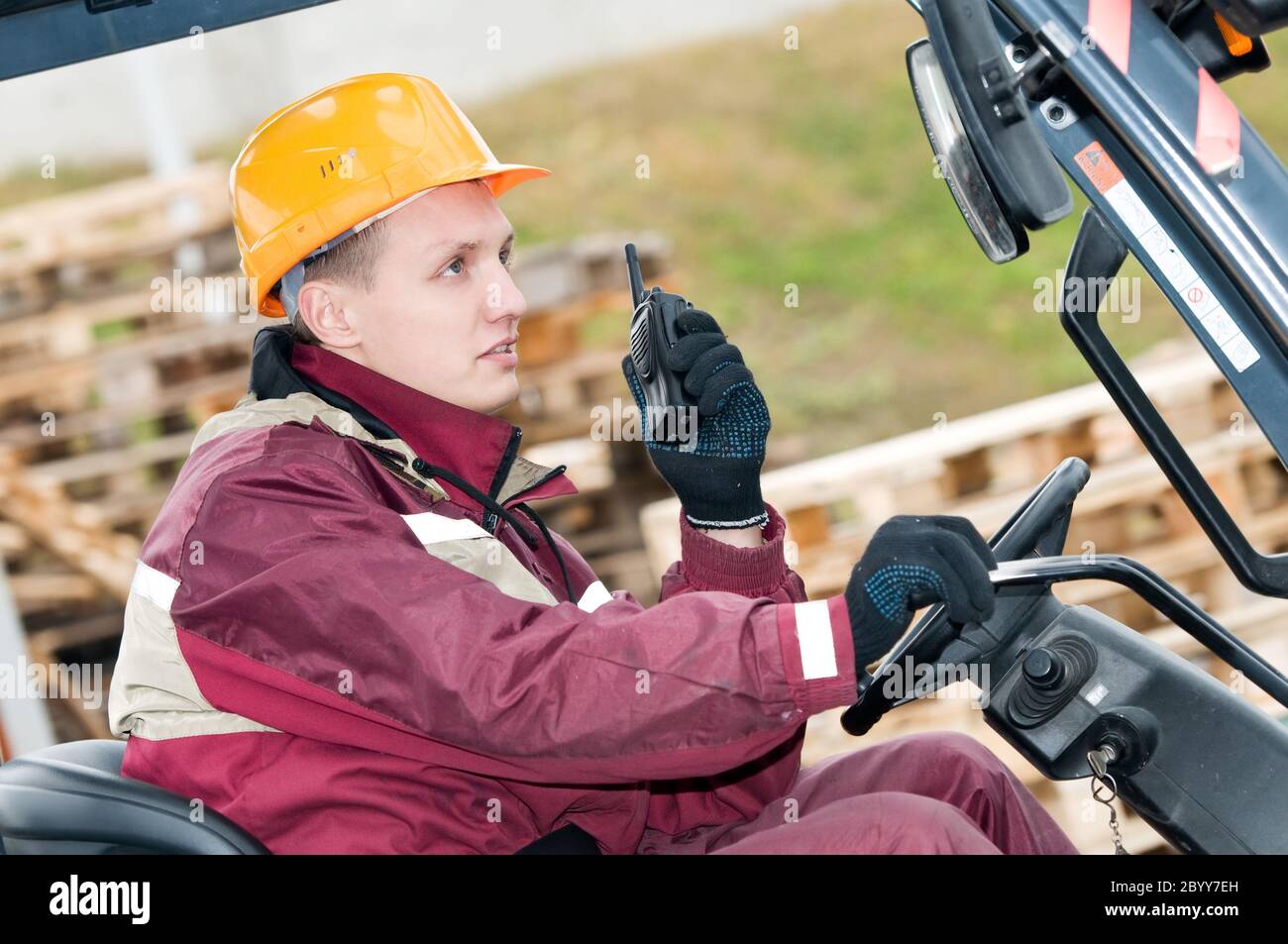 forklift driver with radio transmitter Stock Photo