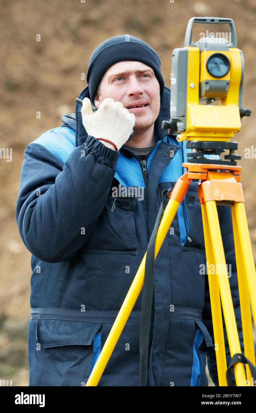 surveyor works with theodolite tacheometer Stock Photo Alamy