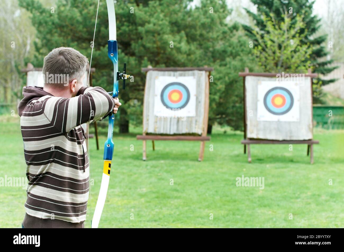 Archer aiming with bow Stock Photo Alamy