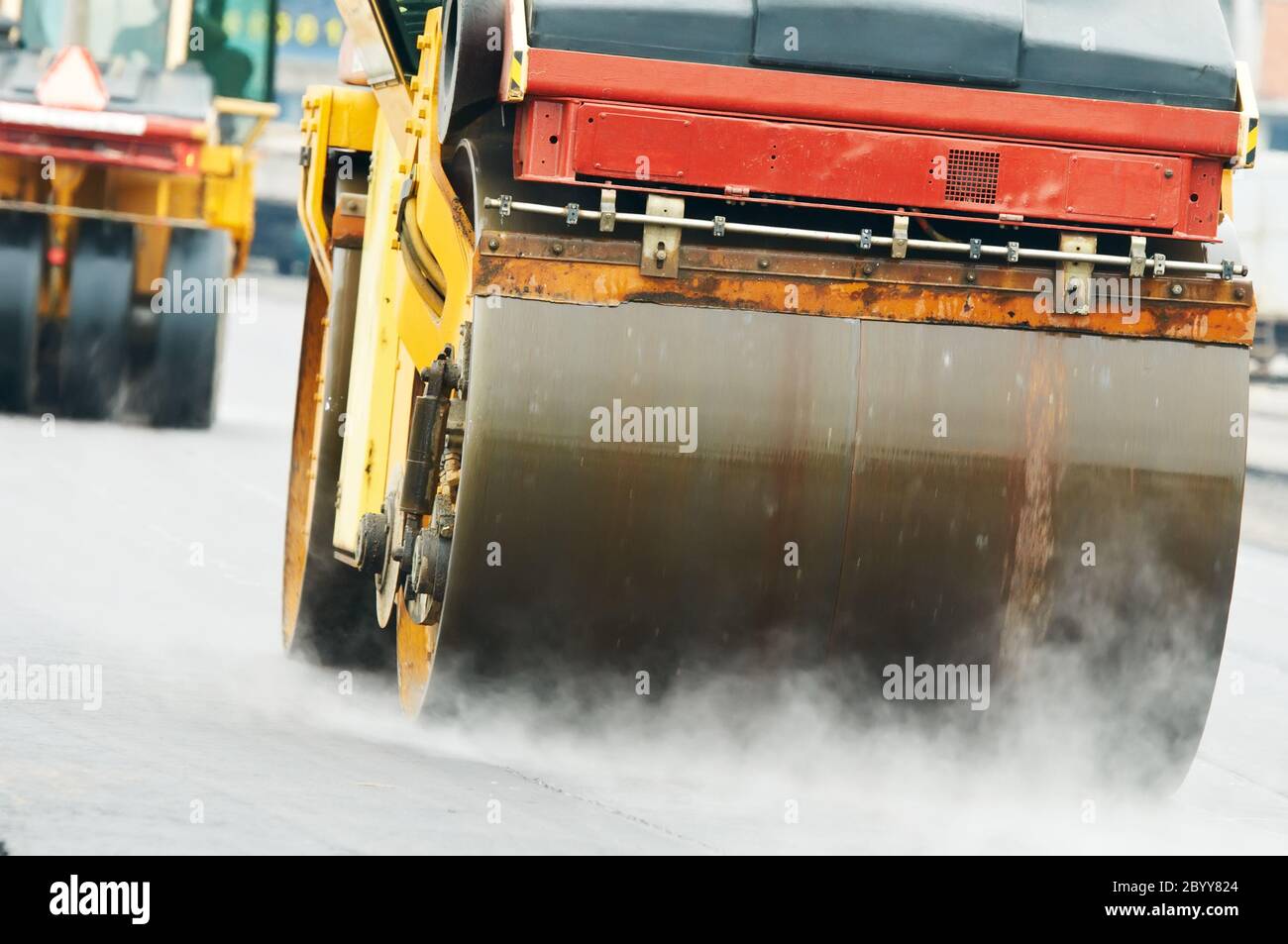 compactor roller at asphalting work Stock Photo Alamy