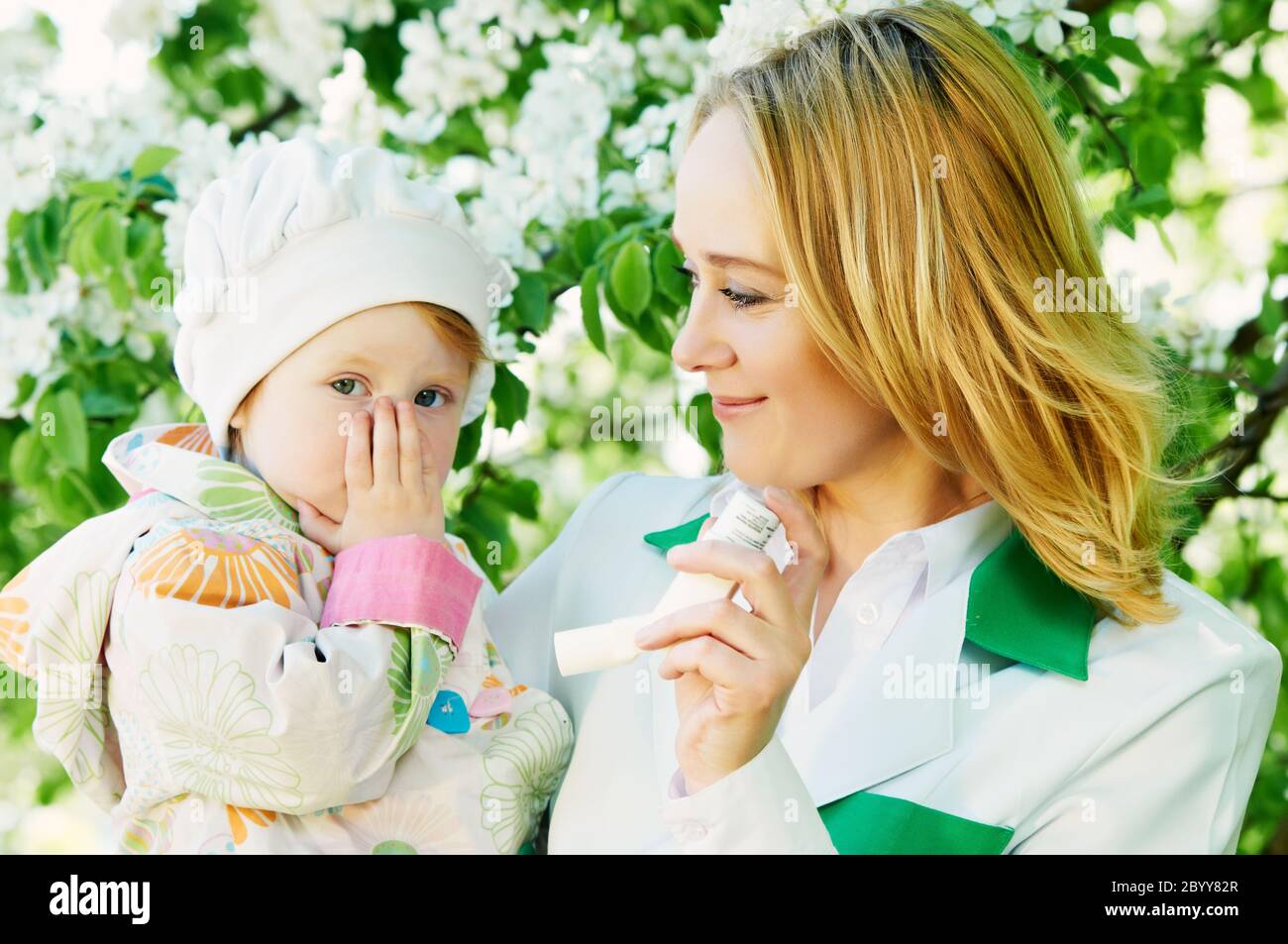 Baby and doctor with inhaler Stock Photo