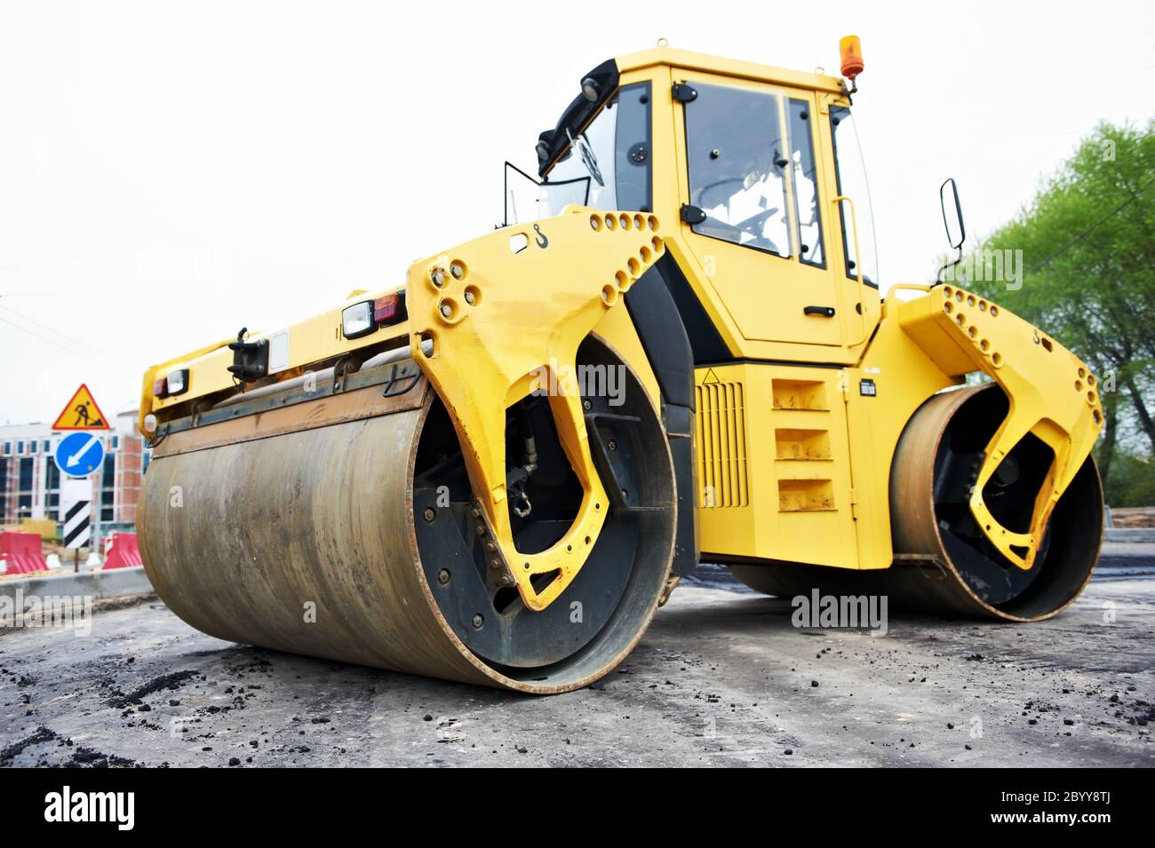 compactor roller at asphalting work Stock Photo