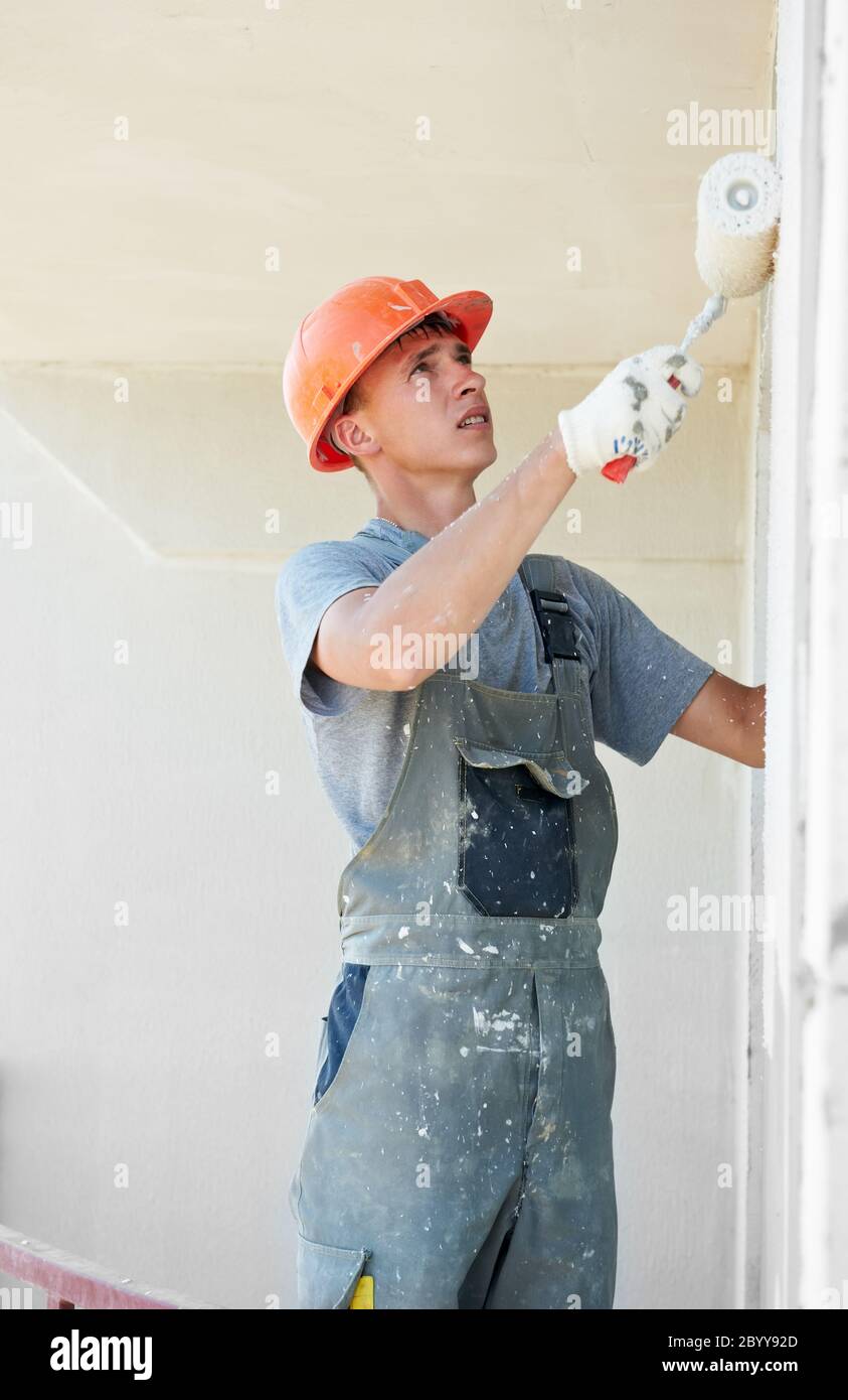 builder facade plasterer worker Stock Photo