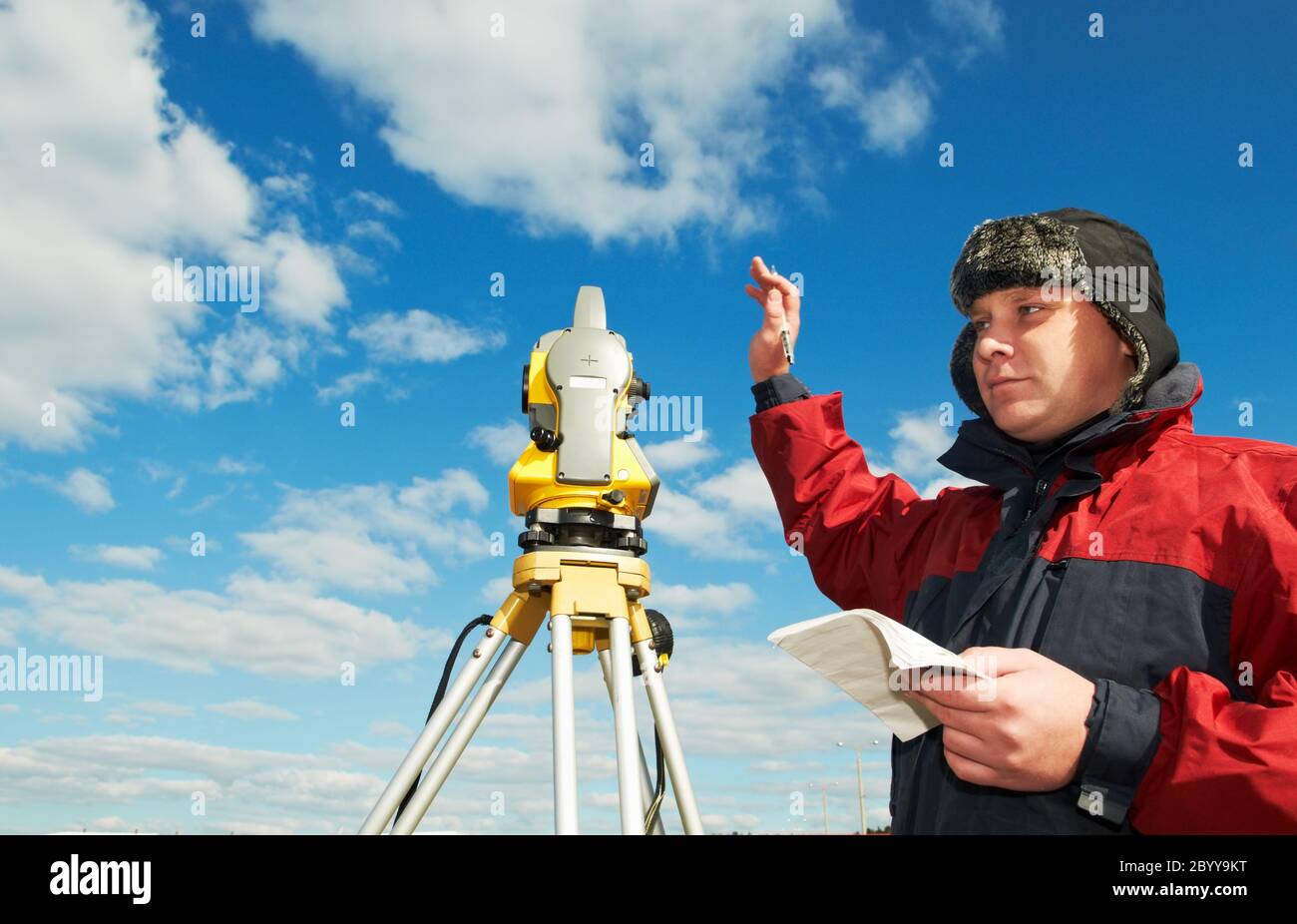 surveyor works with theodolite tacheometer Stock Photo