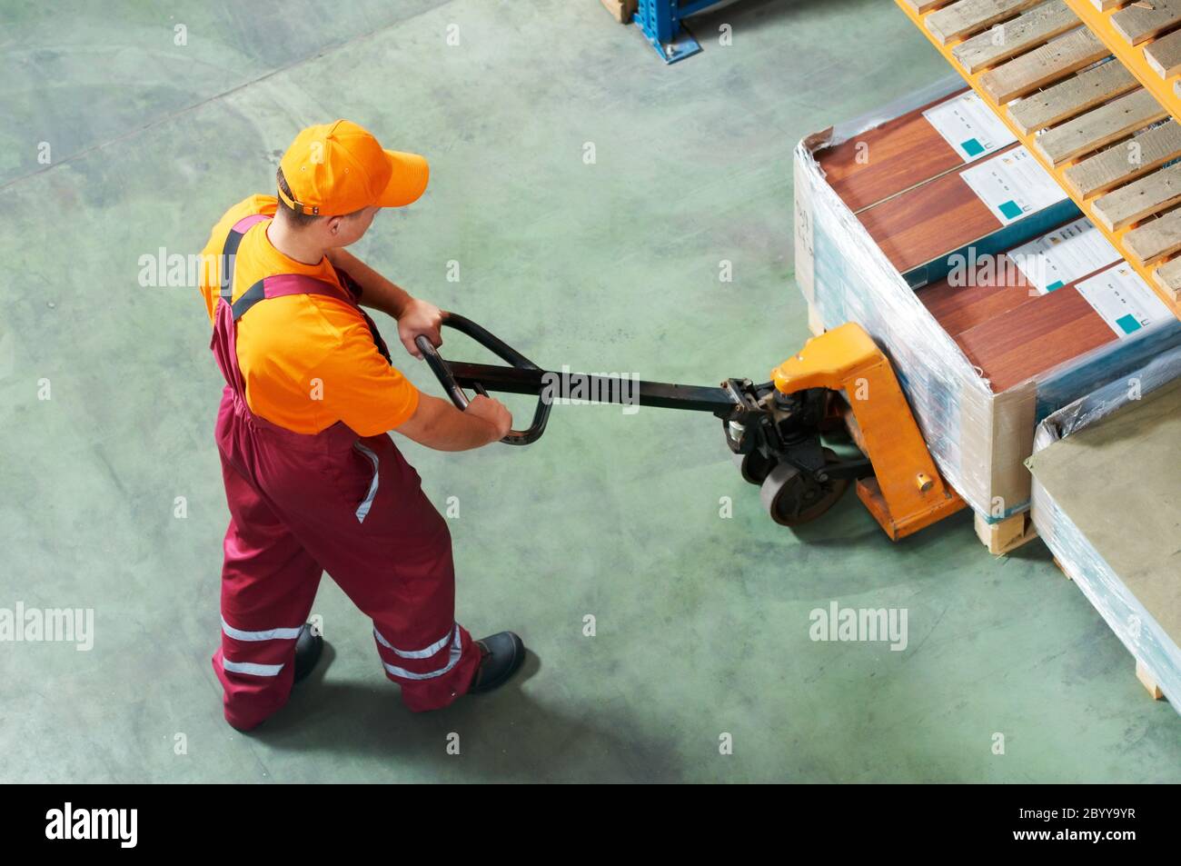 worker with fork pallet truck Stock Photo