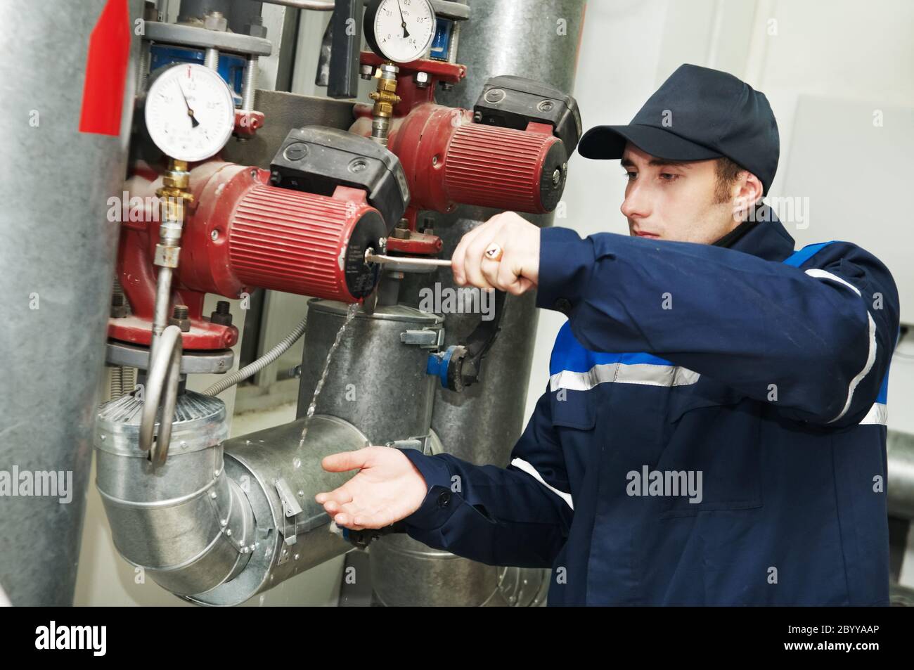 heating engineer repairman in boiler room Stock Photo