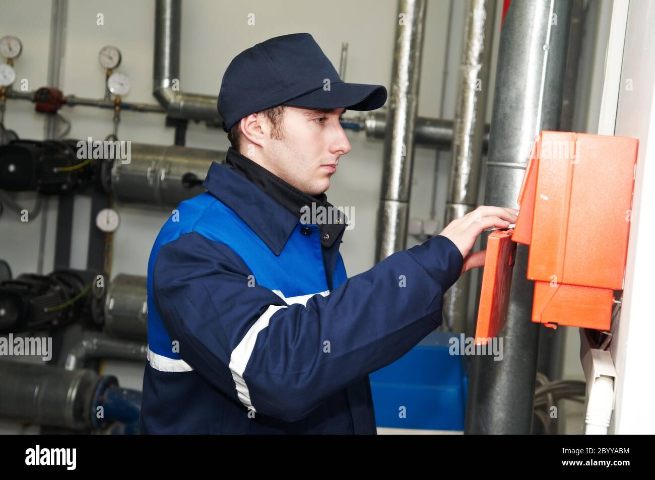 heating engineer repairman in boiler room Stock Photo Alamy