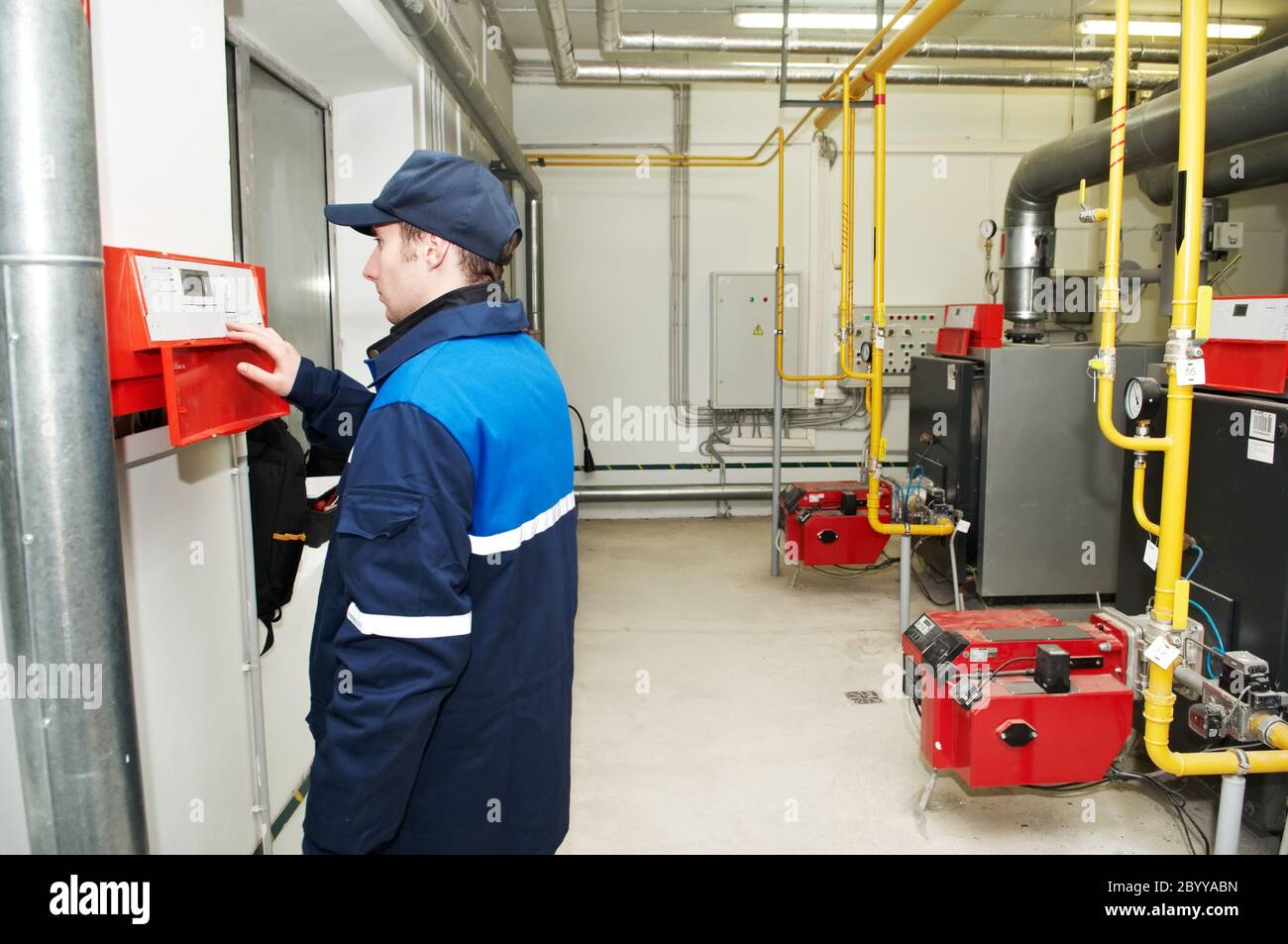 heating engineer repairman in boiler room Stock Photo Alamy