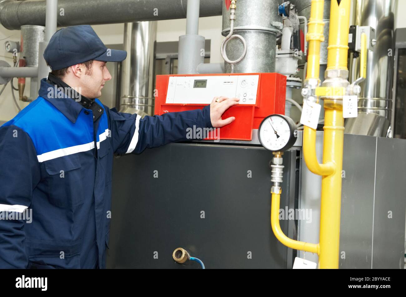 heating engineer repairman in boiler room Stock Photo Alamy