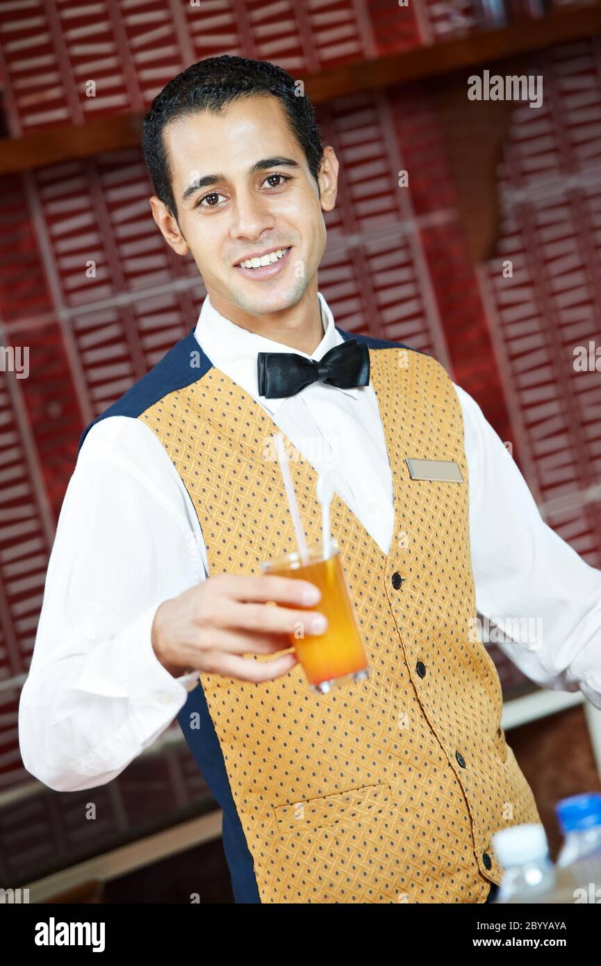 Cheerful arab barman Stock Photo