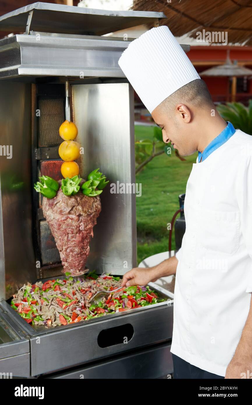 Arab chef making kebab Stock Photo