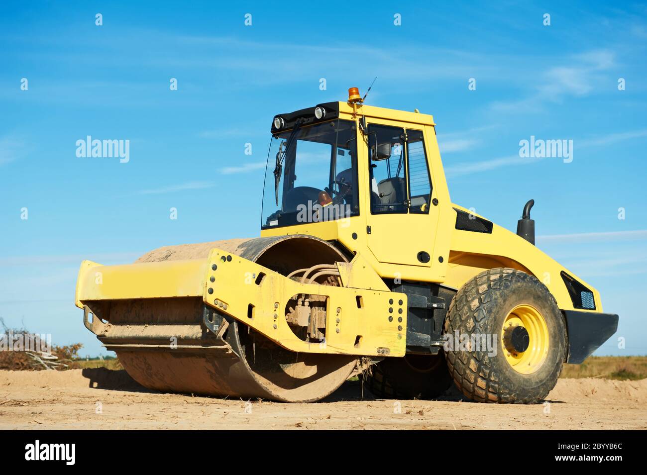 Compactor at road compaction works Stock Photo Alamy