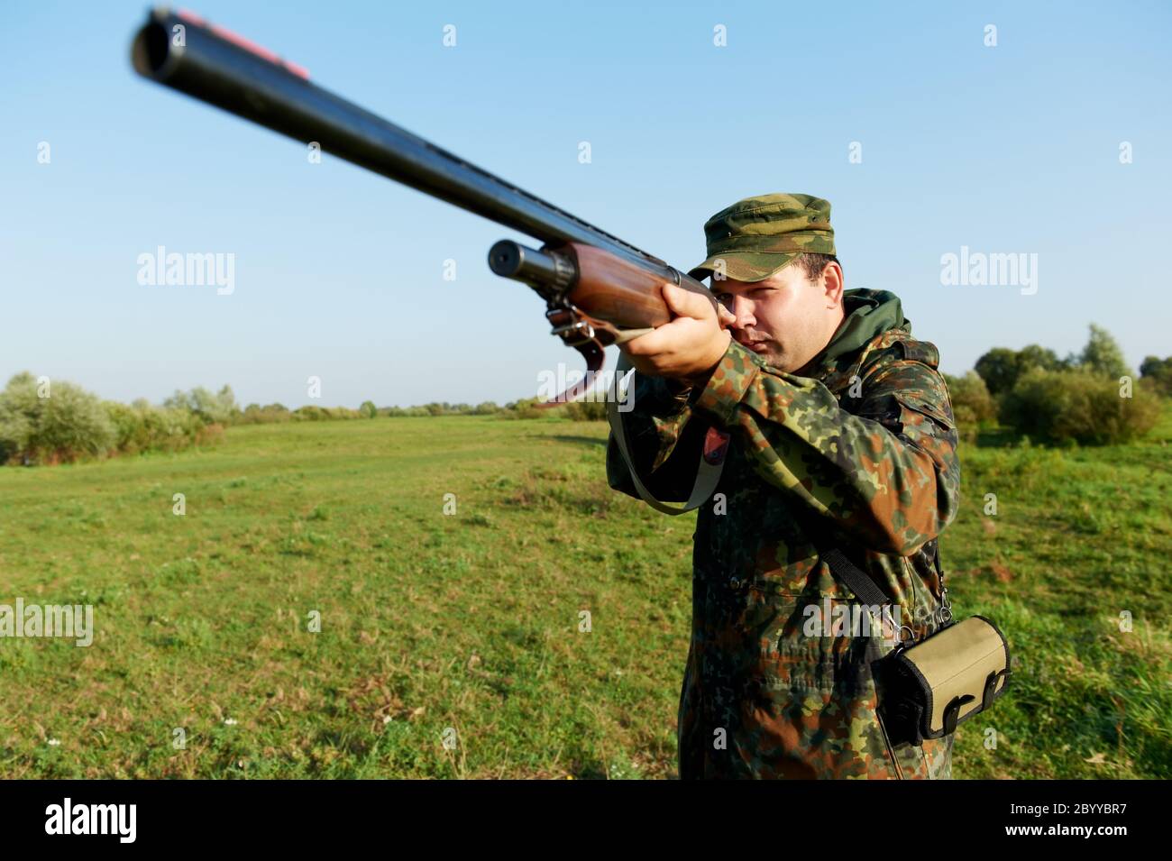 hunter with rifle gun Stock Photo