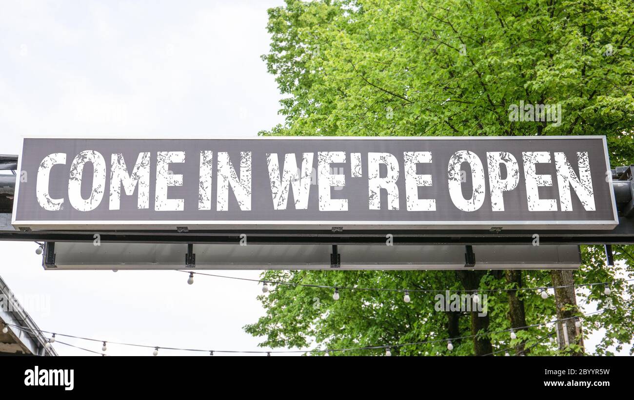 Come in We're Open. Advertising banner in urban environment. Business ...