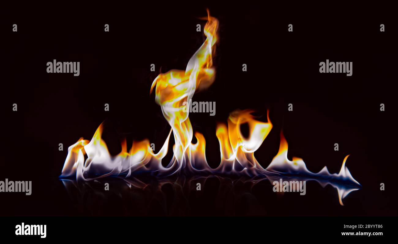 Beautiful flame with reflection on a black background. Stock Photo